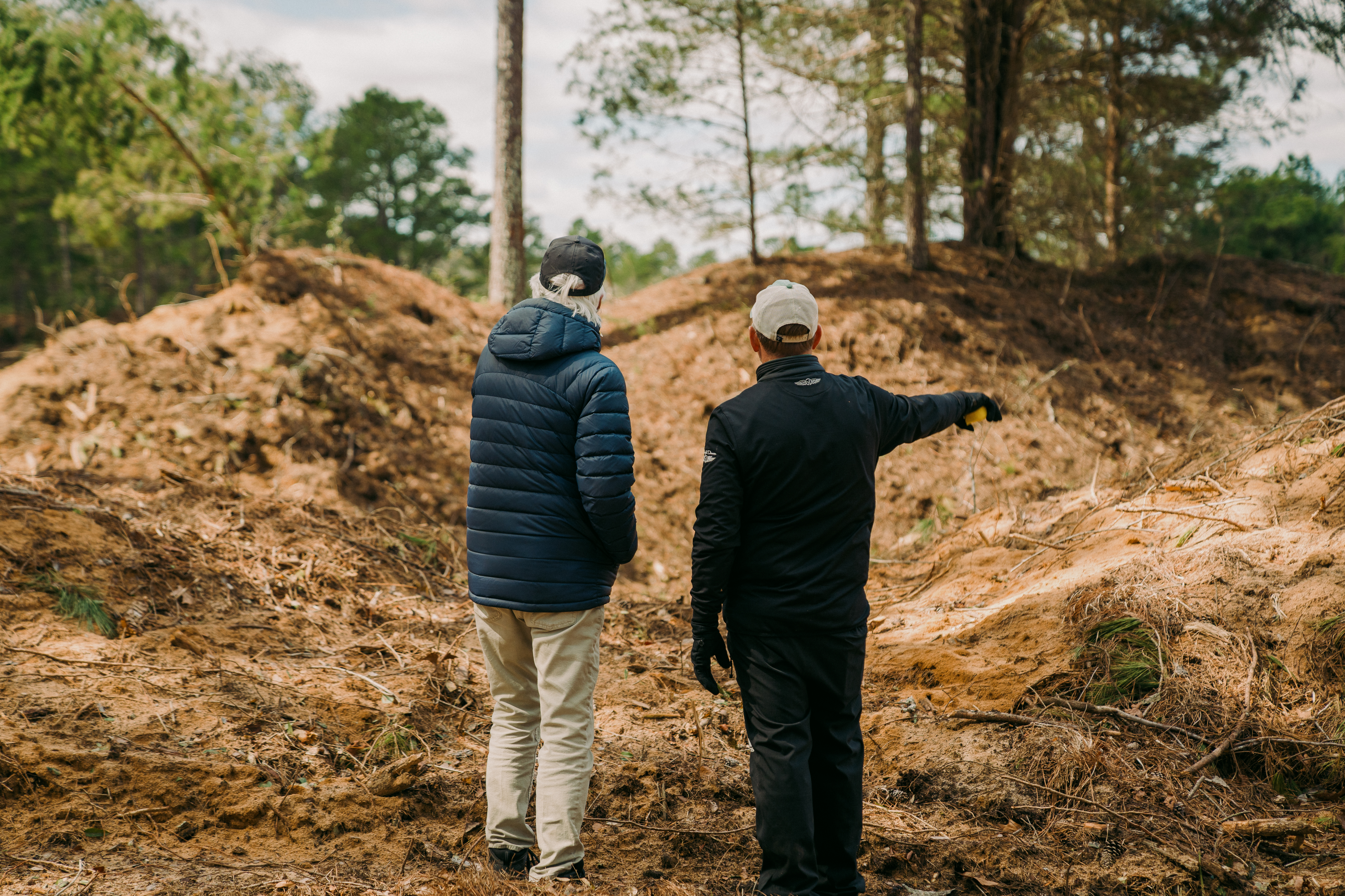 Bill Coore, left, walks the property of Pinehurst No. 11 with Pinehurst Resort Golf Course Maintenance Manager Kevin Robinson.