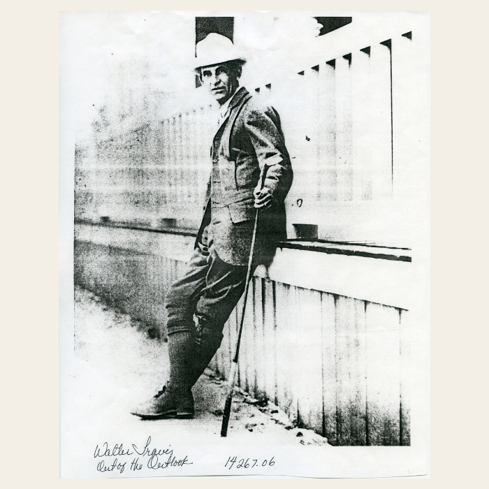 Mr. Travis posing for photo in Outlook magazine (1904)
